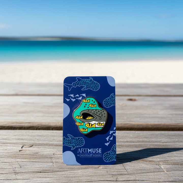 Whale Shark with yellow fish Enamel Pin in an oceanside scene.